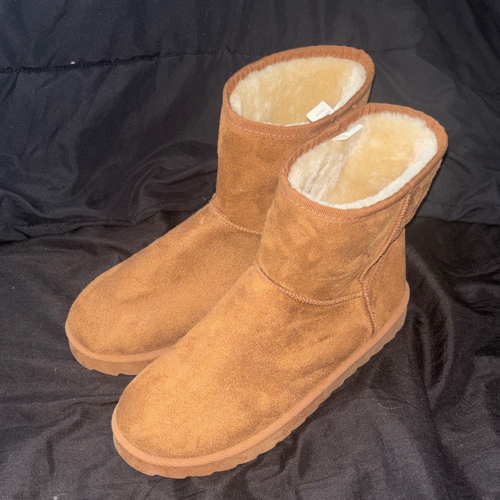 Light brown fur boots.